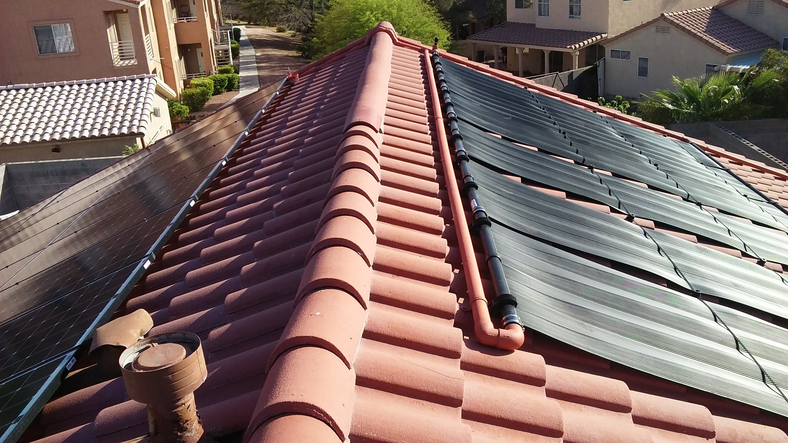 Celestial Solar – Arizona Solar Celestial Solar image shows a sunlit Arizona rooftop with red clay tiles and dark solar panels, featuring Celestial Solar & Water Systems, Inc. installation on a suburban home.